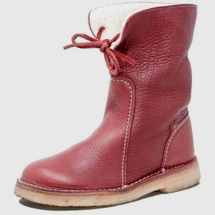 Shearling lined ankle boots worn with jeans tucked in