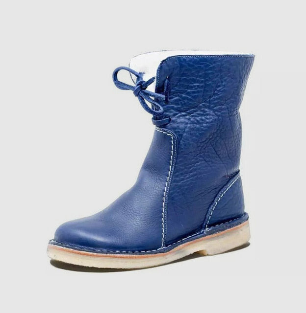 Pair of shearling lined winter ankle boots side by side