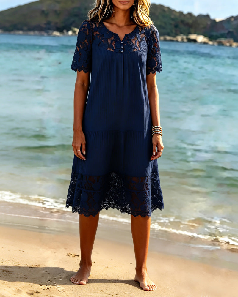 Navy relaxed fit midi dress seen from the side in daylight