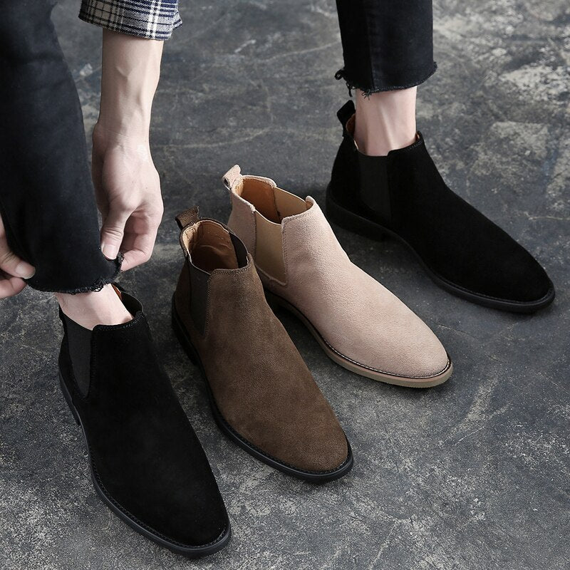 Close view of the slim sole and stacked heel on suede look Chelsea boots