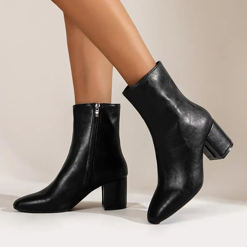 Pointed toe ankle boots worn with tailored trousers