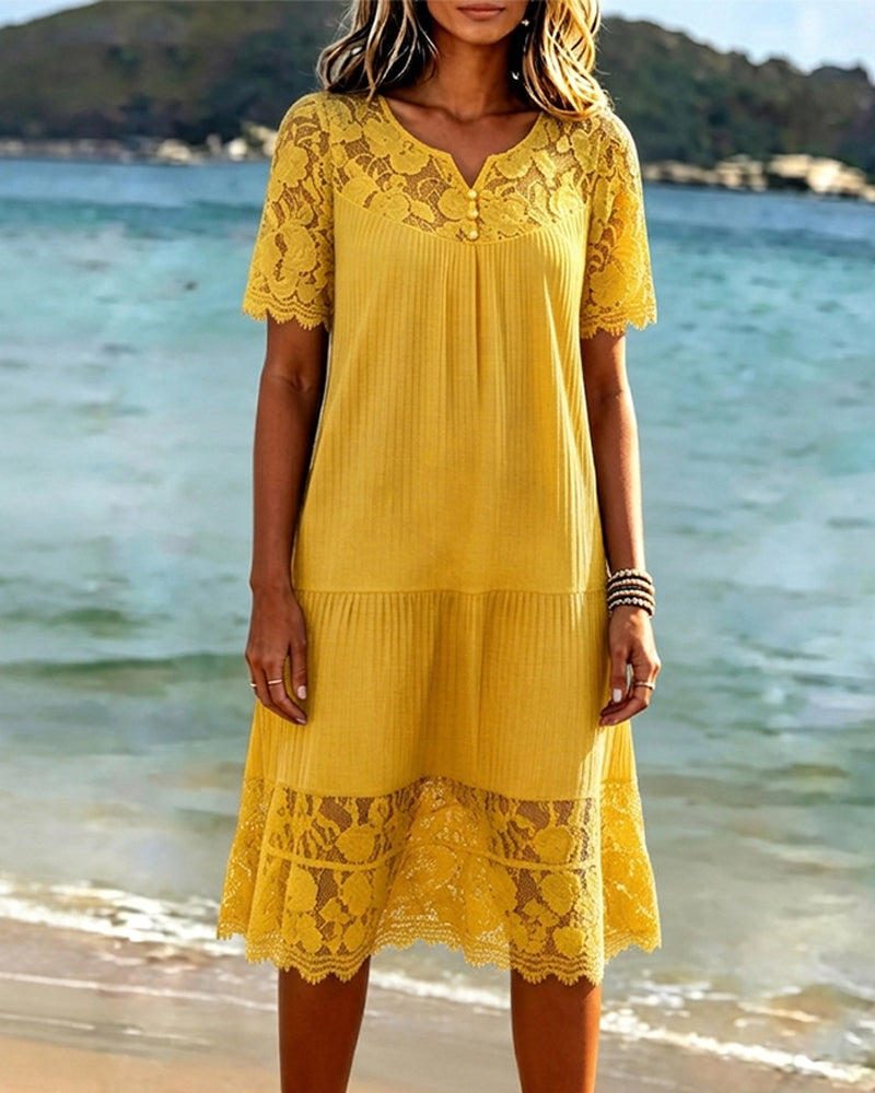 Yellow midi dress showing the openwork lace yoke and button neckline