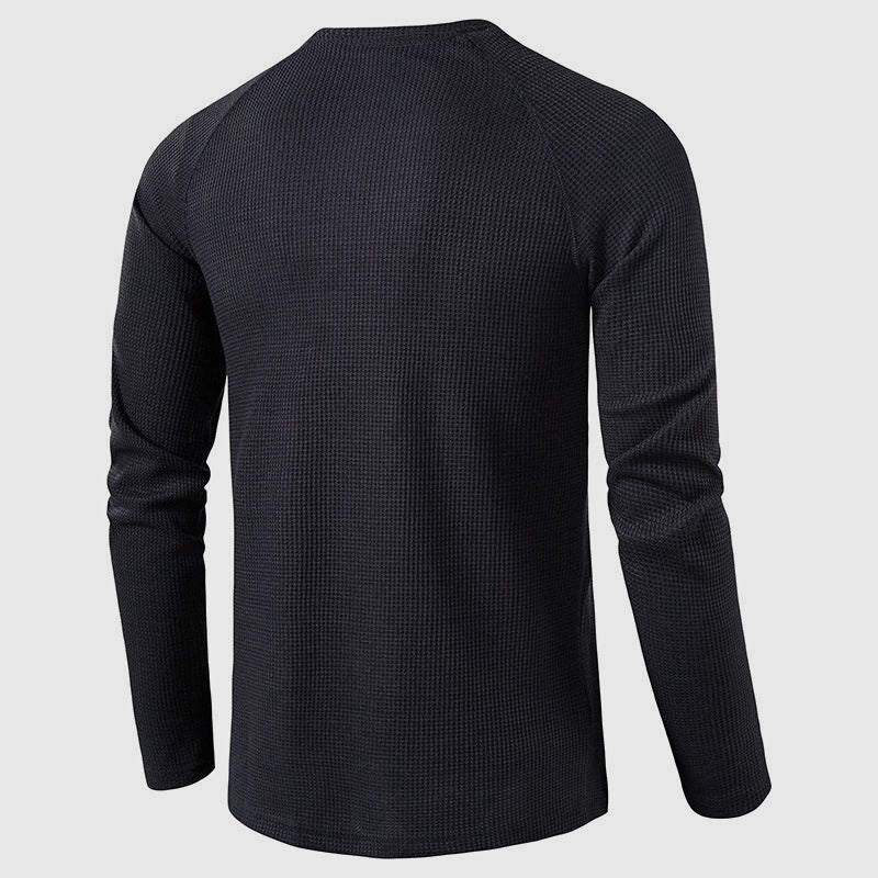 Men's waffle knit henley worn as a layer under a jacket