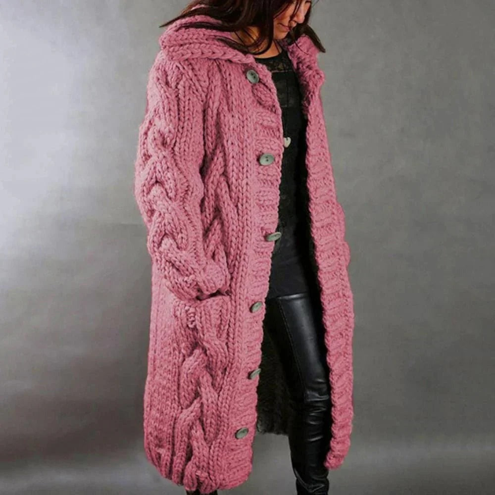 Women's pink hooded cable knit cardigan falling to mid calf