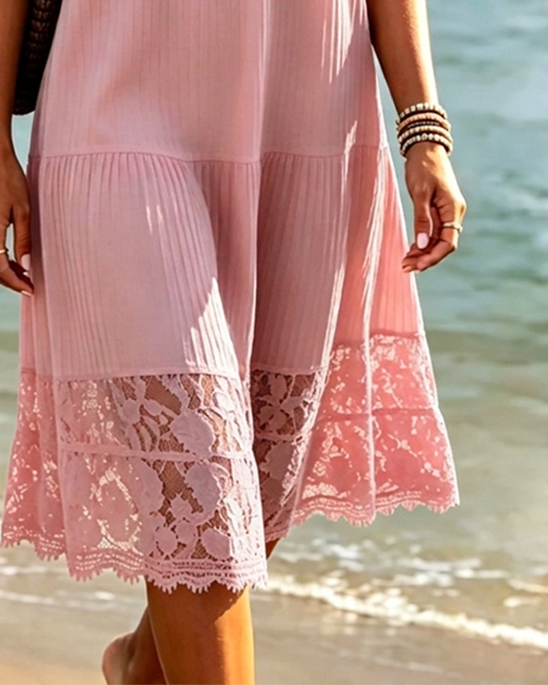 Pink relaxed fit midi dress seen from the side in daylight