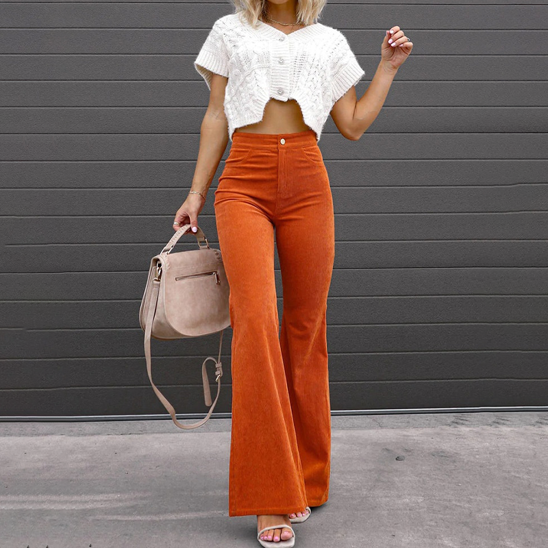 Corduroy flare trousers worn with boots under the hem