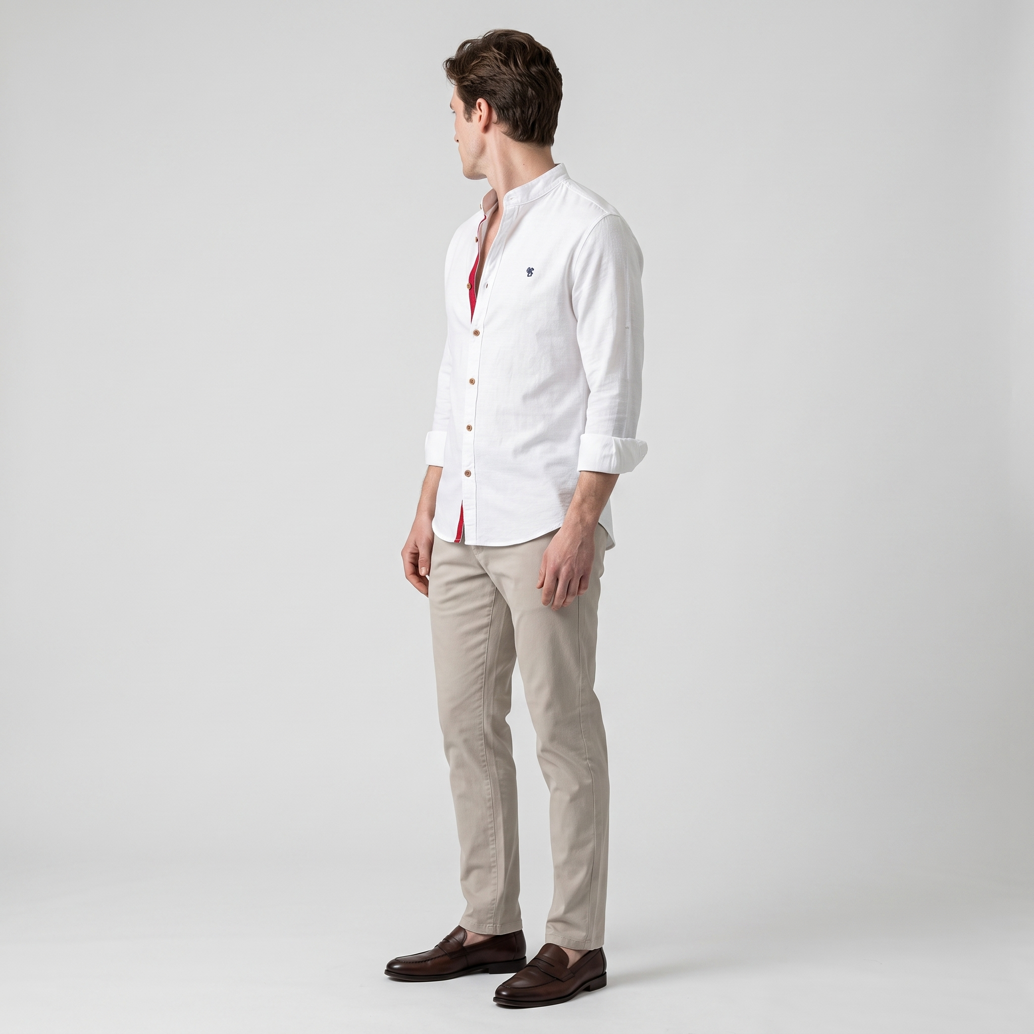 Side view of a white mandarin collar shirt showing the red placket facing