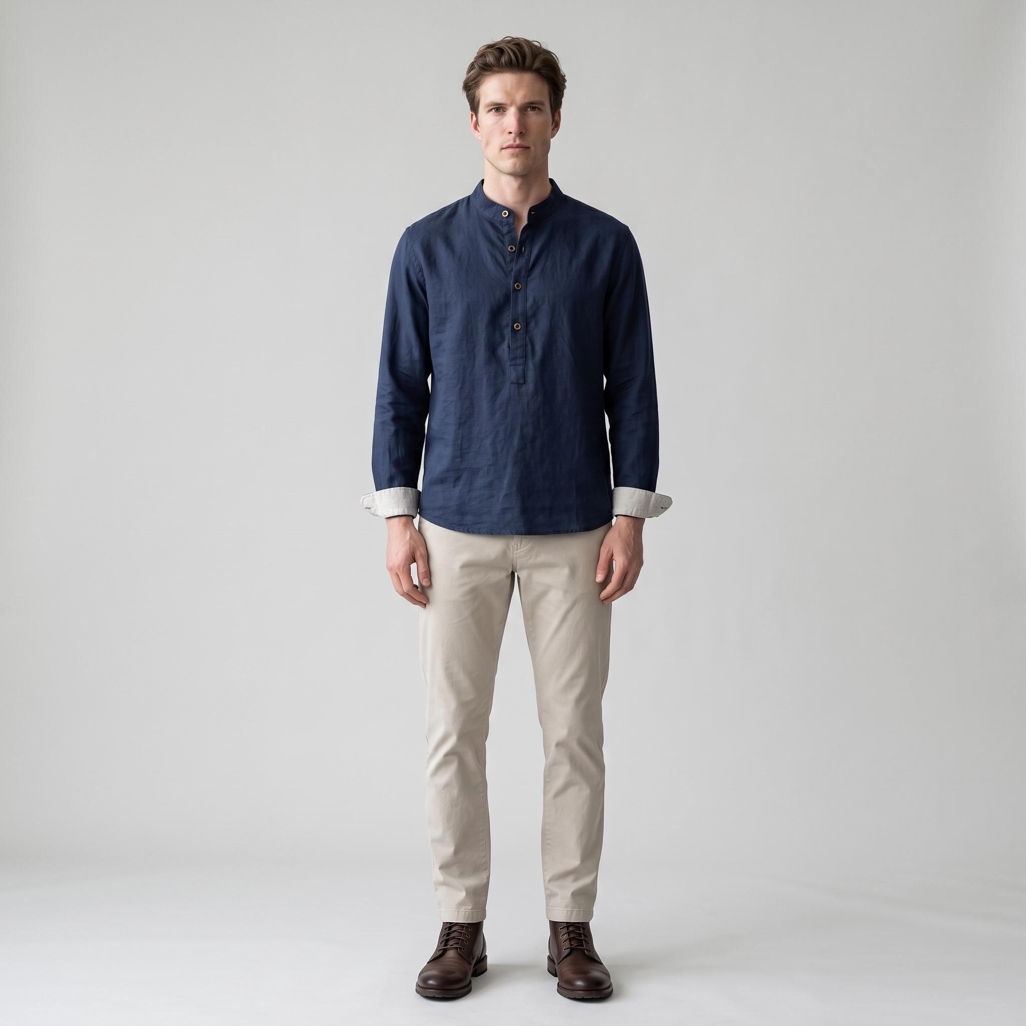 Man wearing a navy cotton linen popover shirt with grandad collar and half placket