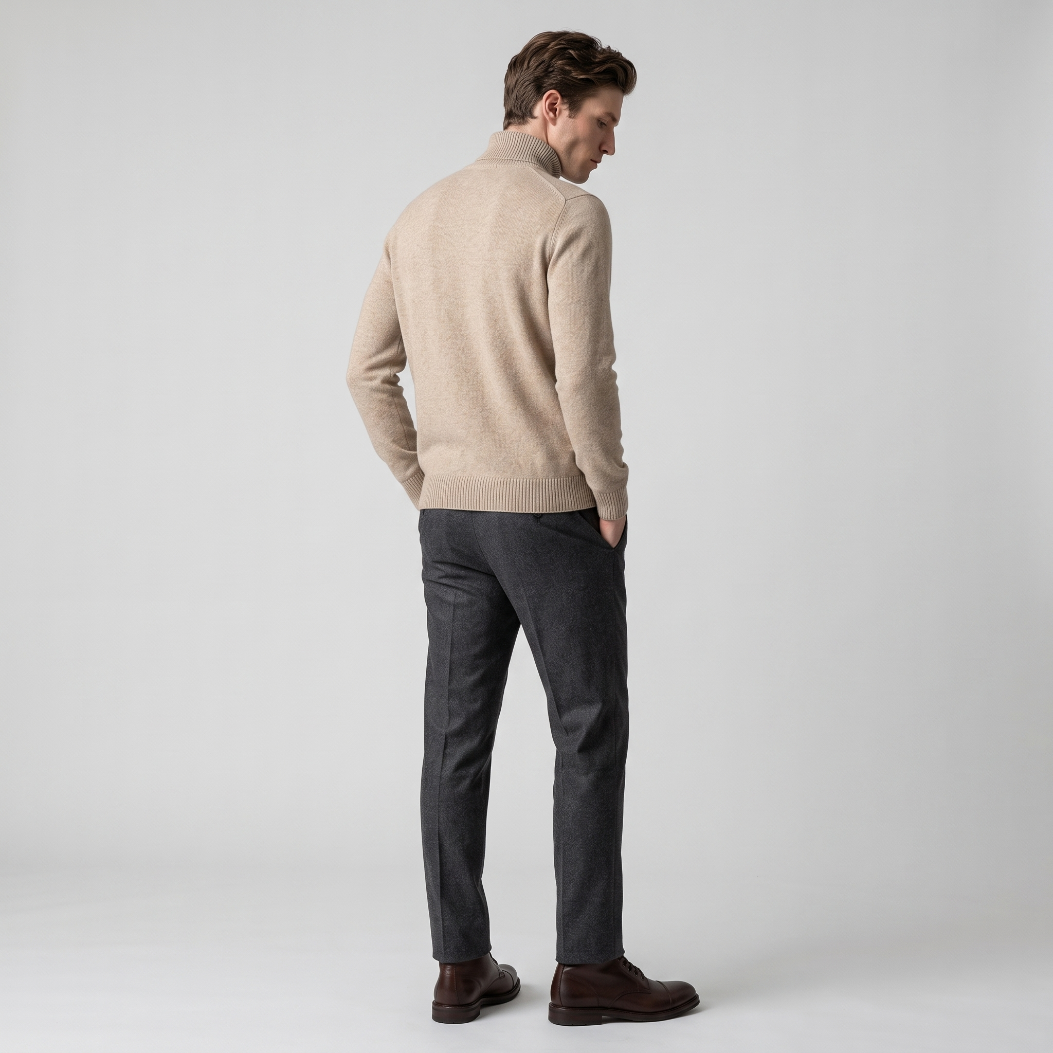 Side view of a beige fine knit roll neck jumper with a folded collar
