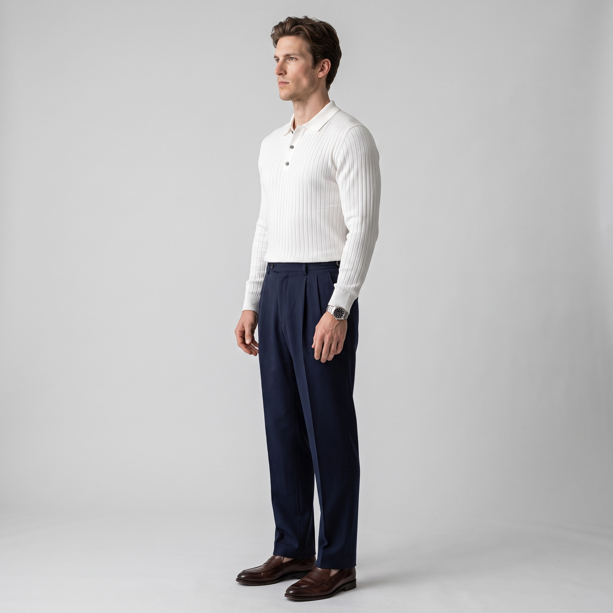 Side view of a white fine rib knit polo showing the ribbed cuffs