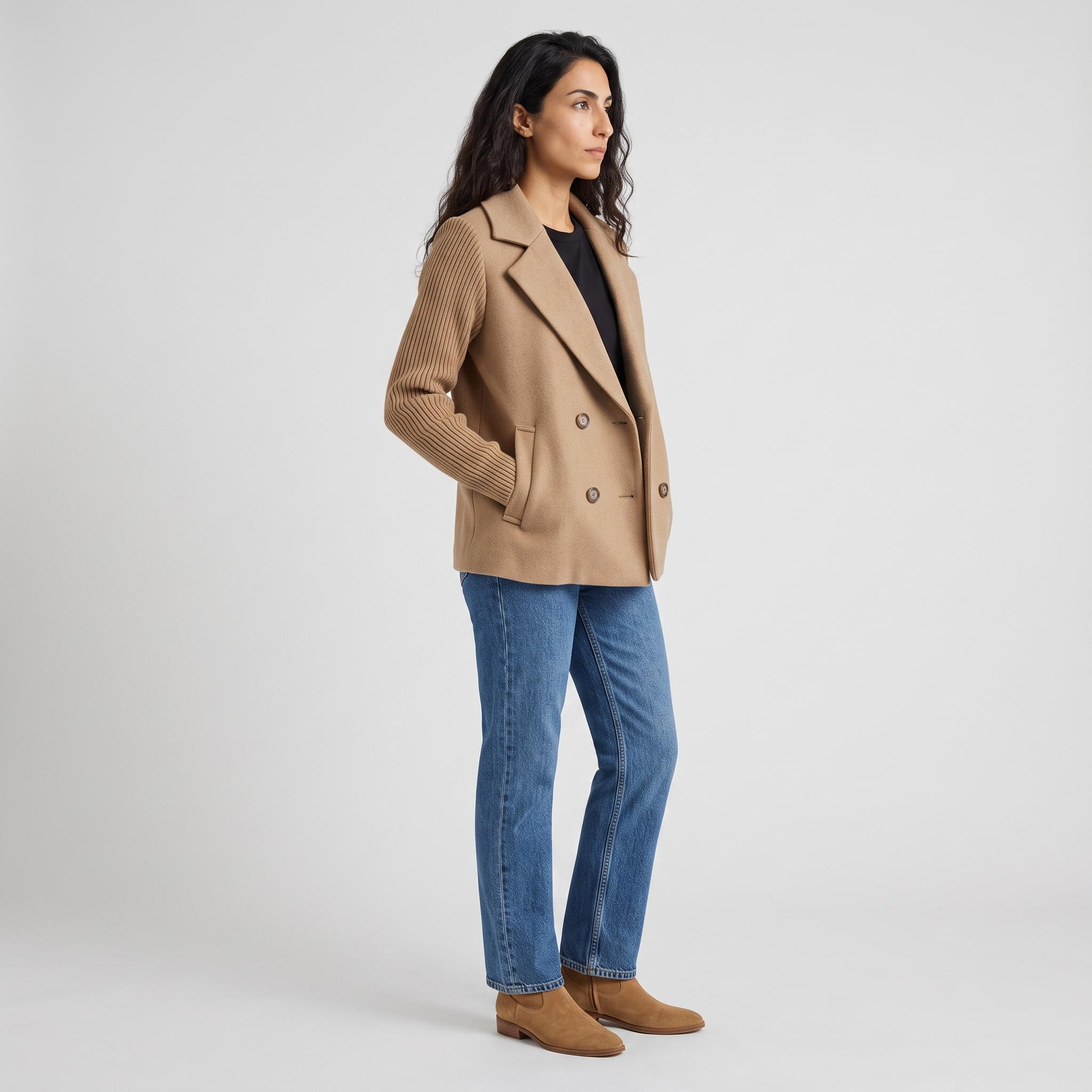 Side view of a camel wool look blazer showing the chunky knit sleeve