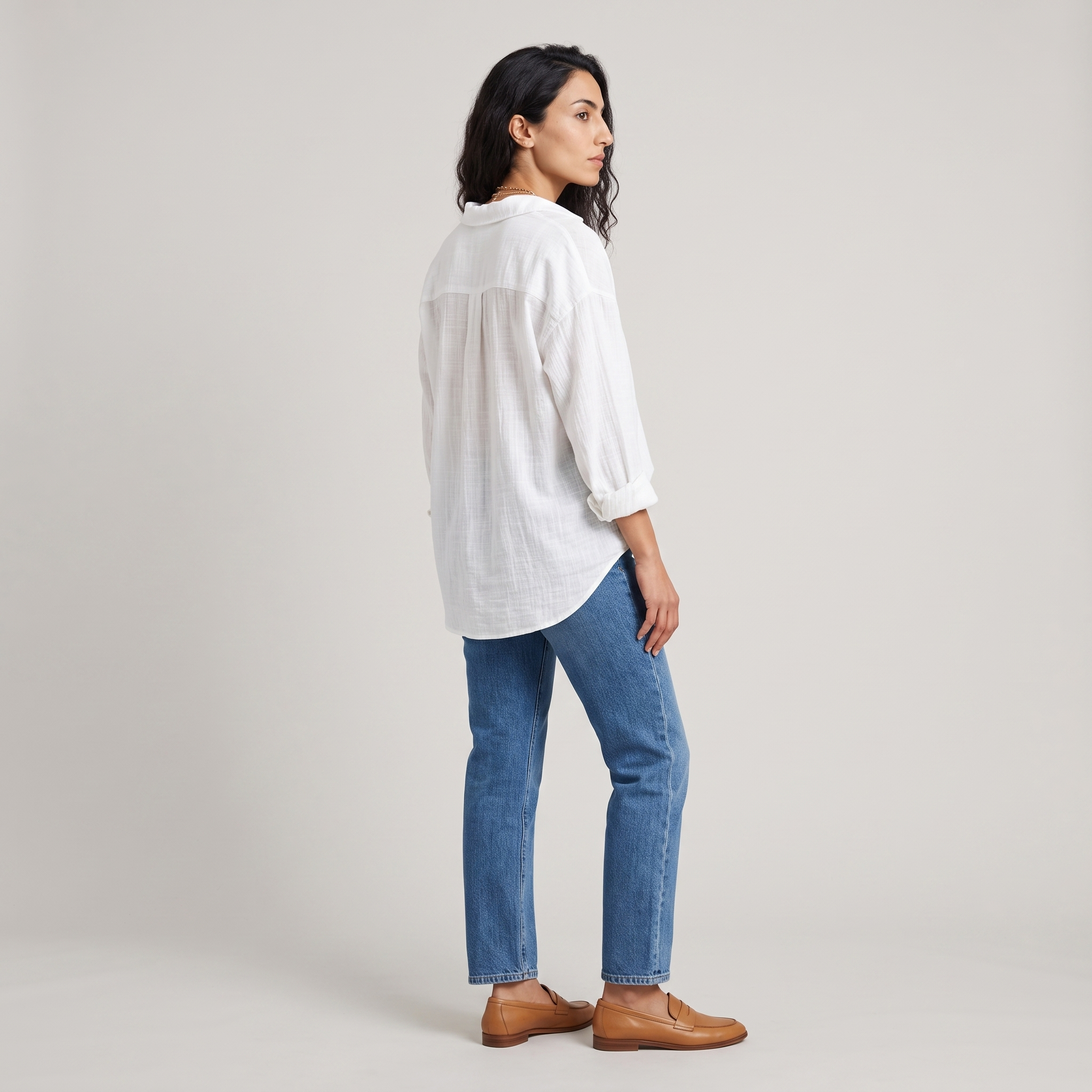 Side view of a white crinkle weave blouse with dropped shoulders