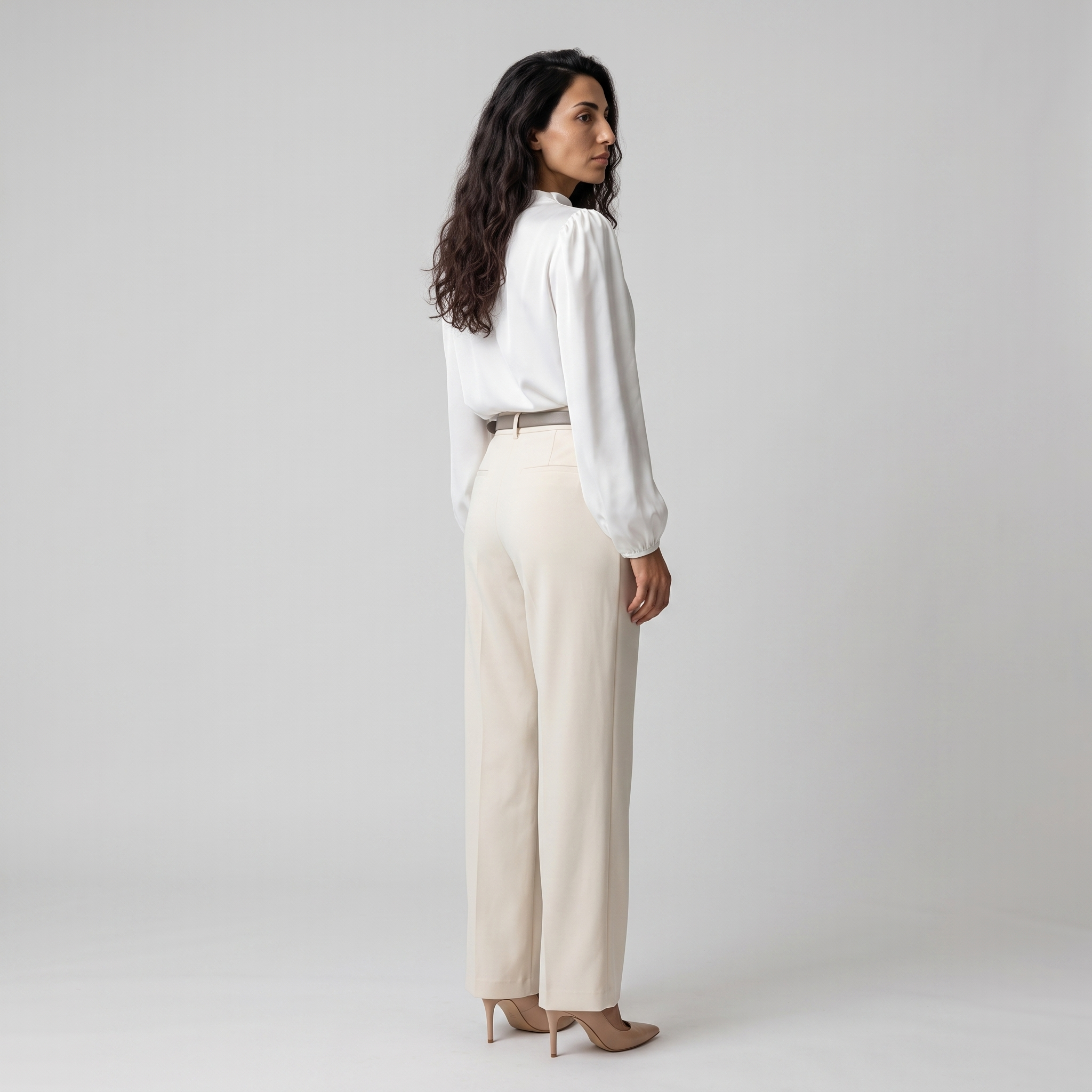 Side view of a white satin blouse showing the gathered puff shoulder