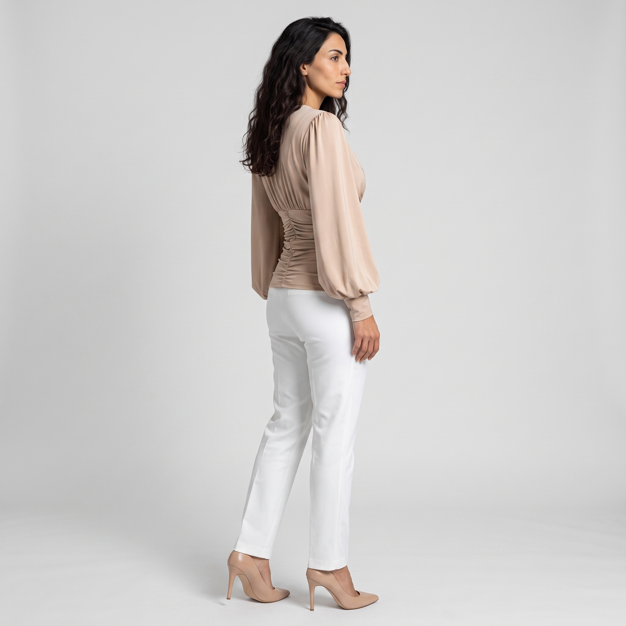 Side view of a wrap V-neck blouse showing the ruched waist