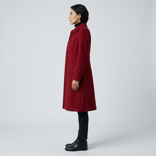 Side profile of deep red wool-look overcoat showing princess seams and gentle flare
