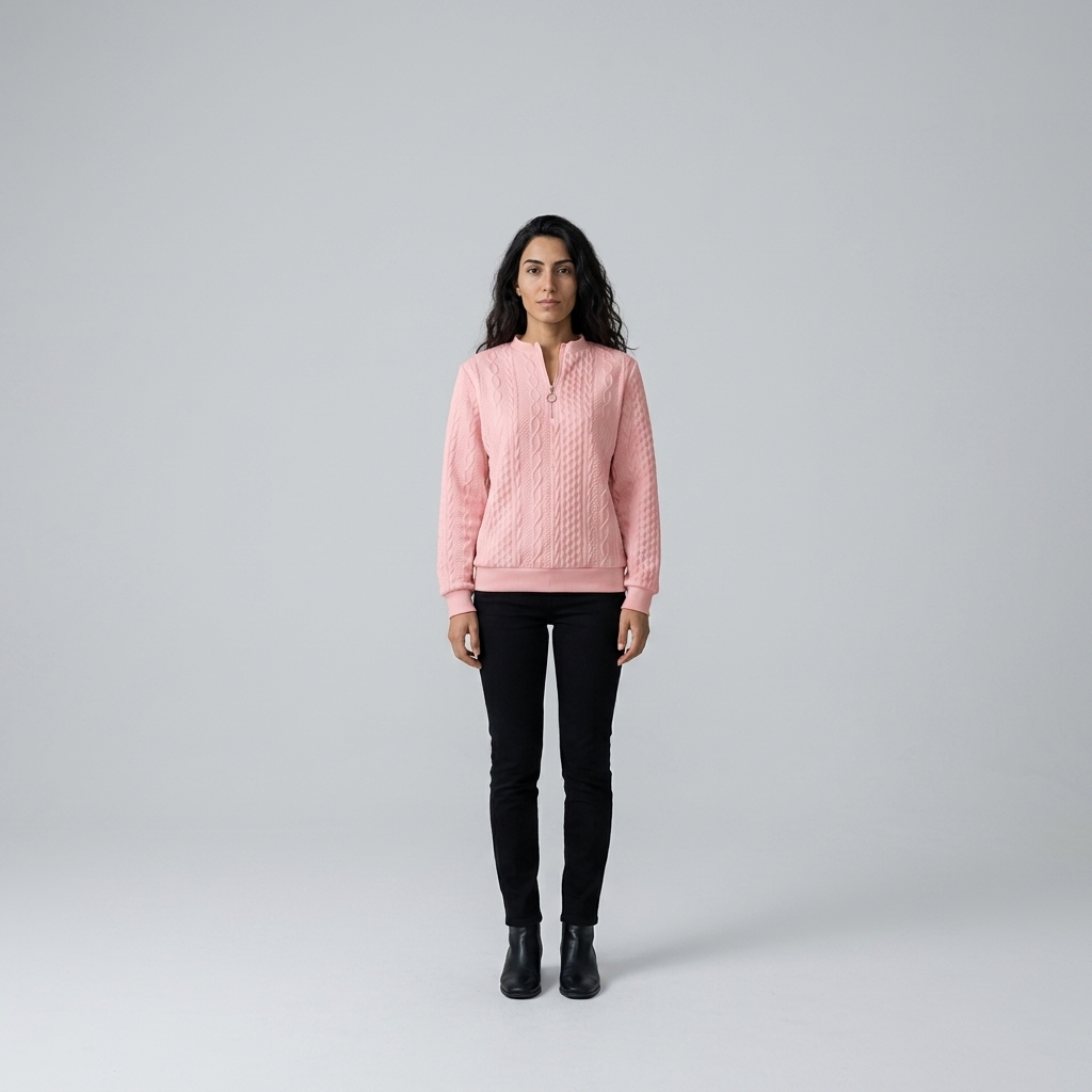 Model wearing pink cable knit quarter zip jumper, front view with ring pull zip