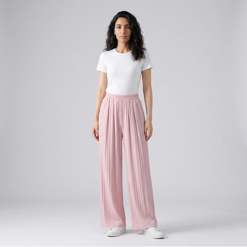 Model wearing pale pink pleated wide leg trousers, full length front view