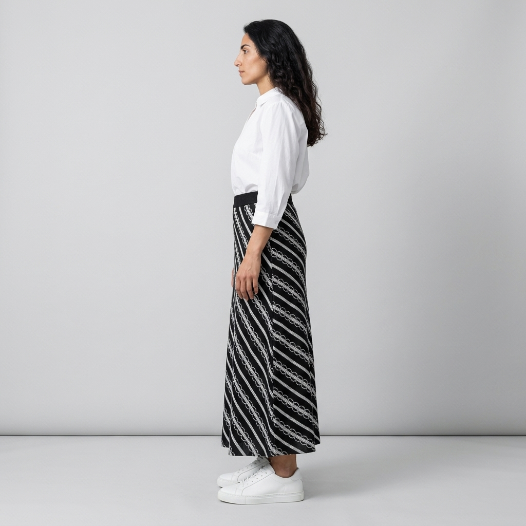 Side view of black and white diagonally striped maxi skirt