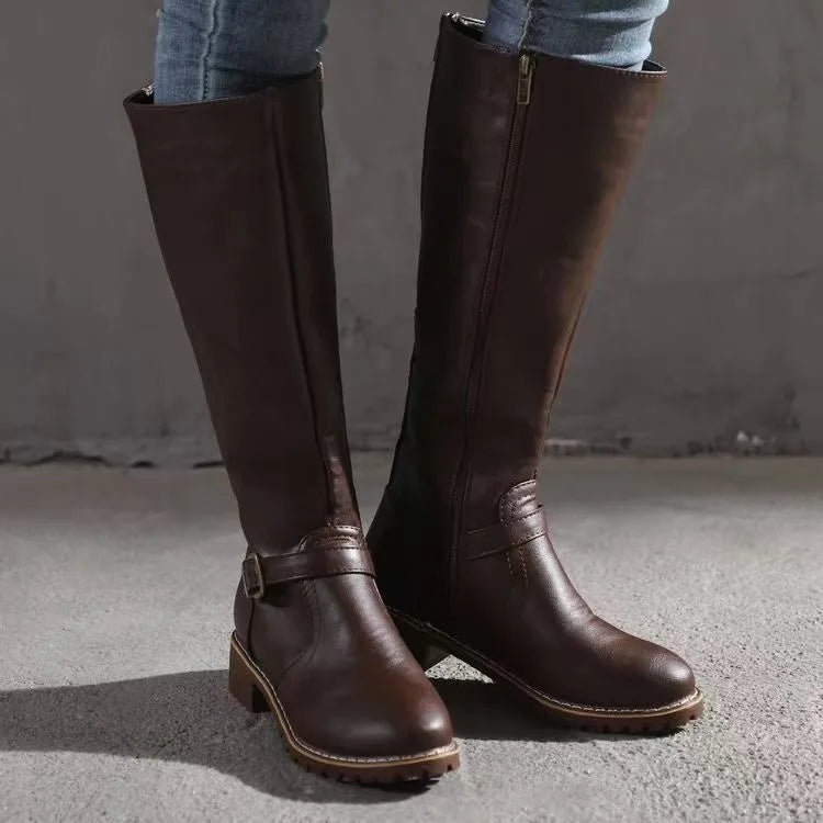 Women's dark brown knee high riding boots shown from the side