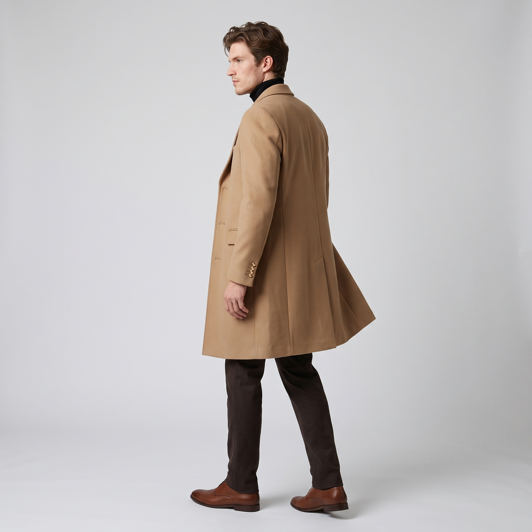 Side view of the camel longline overcoat showing the length and back vent