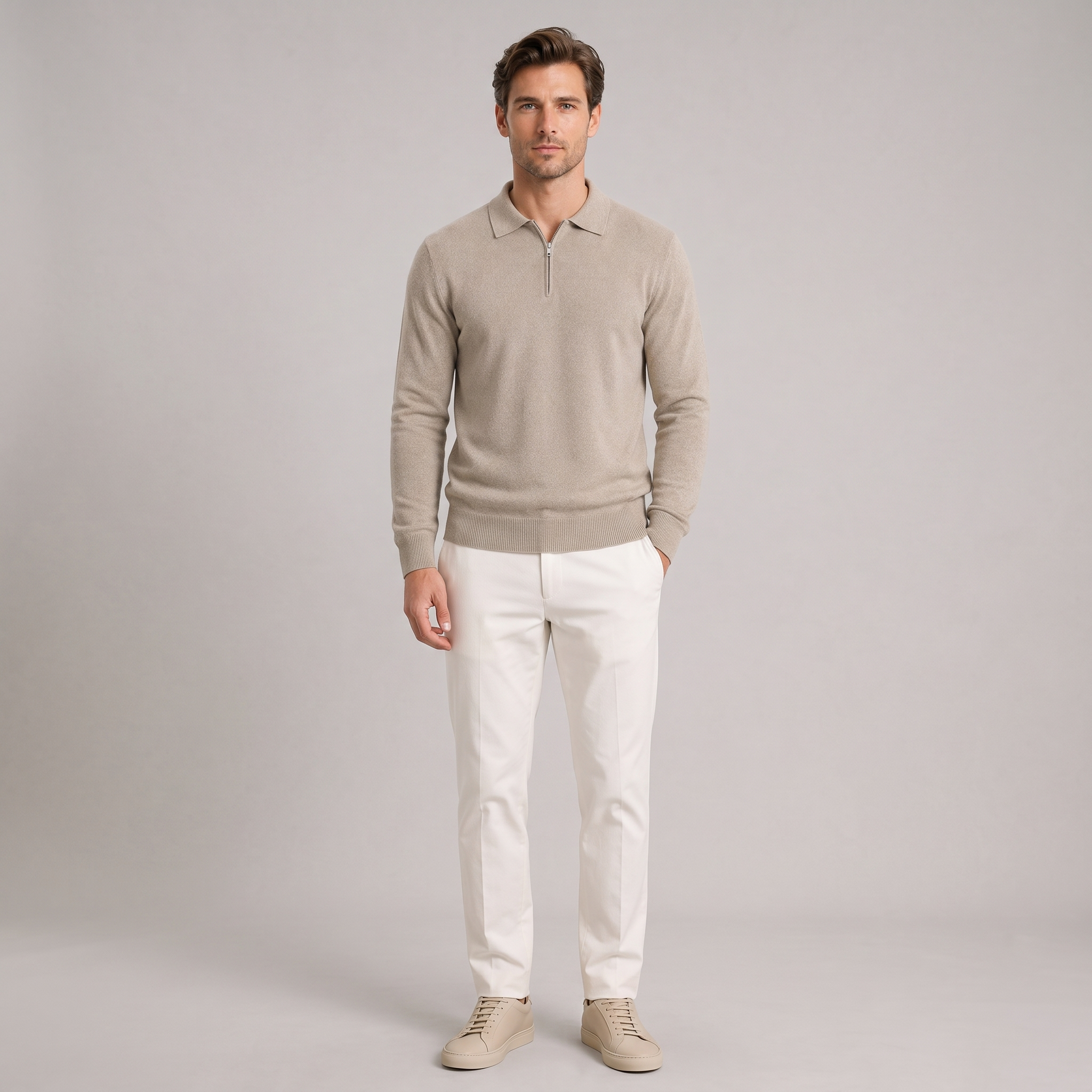 Model wearing the oatmeal quarter zip polo jumper in fine knit, studio shot