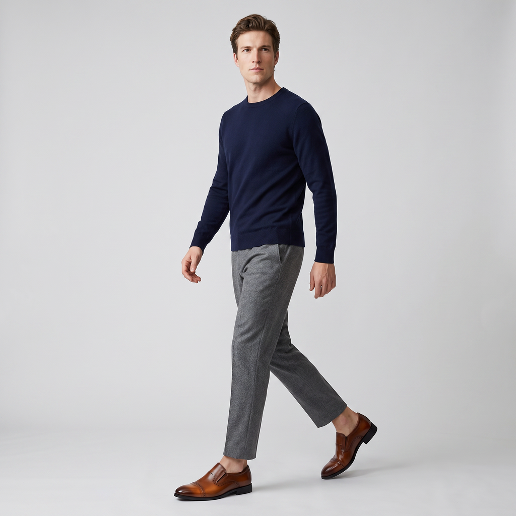 Full length studio shot of a model walking in the brown slip on brogue loafers