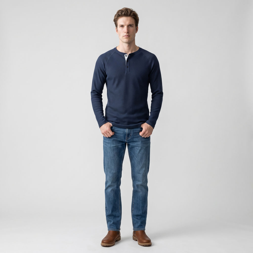 Model wearing the navy waffle knit henley with denim, studio shot