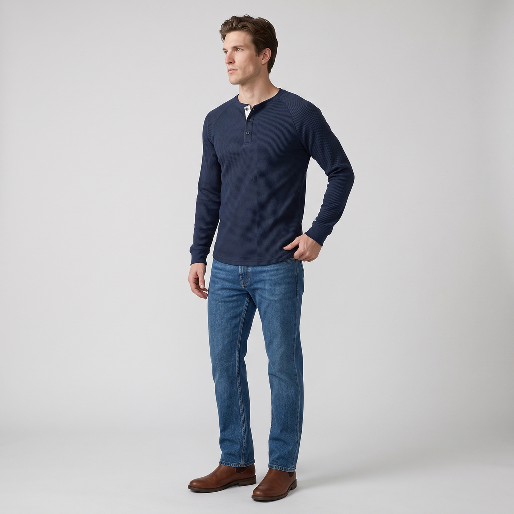 Side view of the navy waffle knit henley showing the raglan sleeve seam