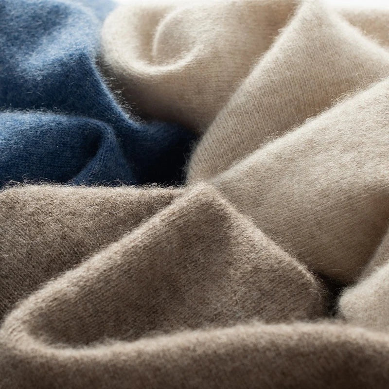 Men's mock neck jumper shown layered under an overcoat