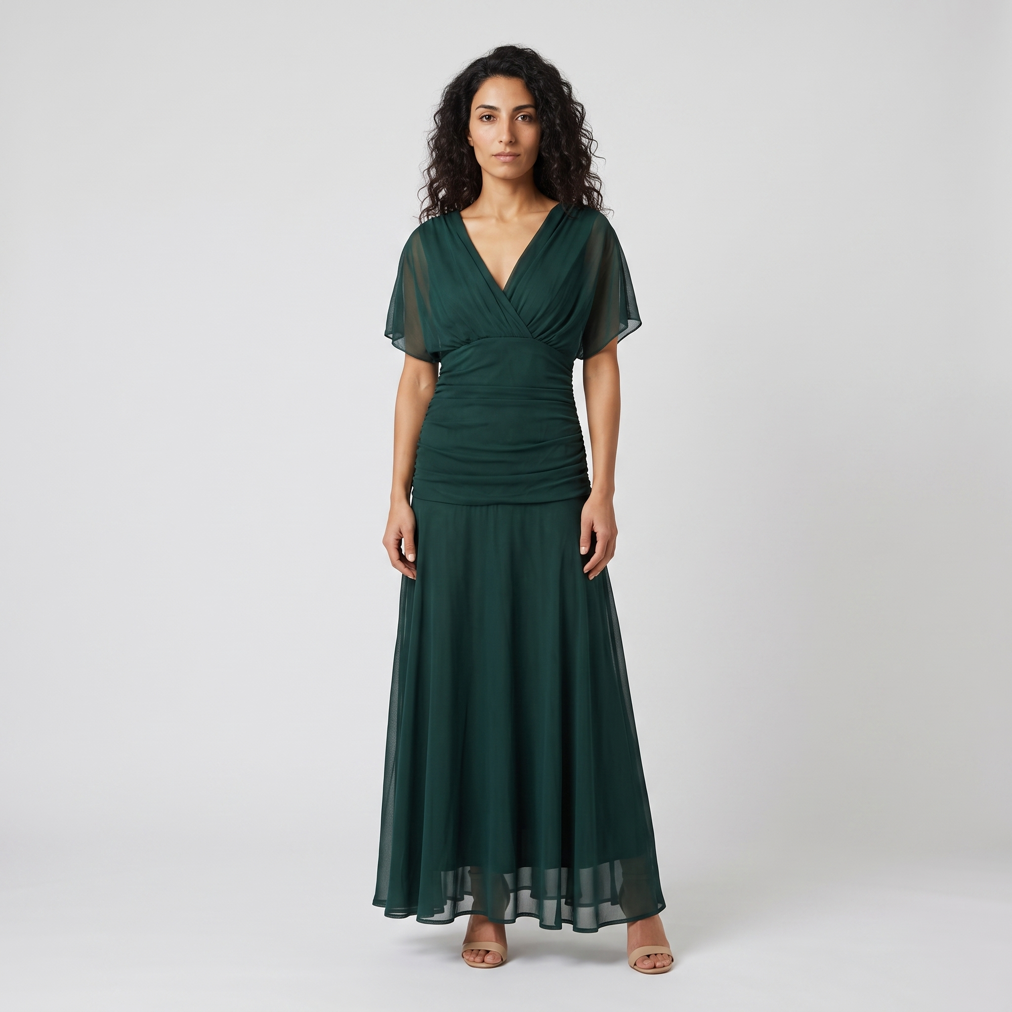 Model wearing the forest green V neck chiffon maxi dress, studio shot