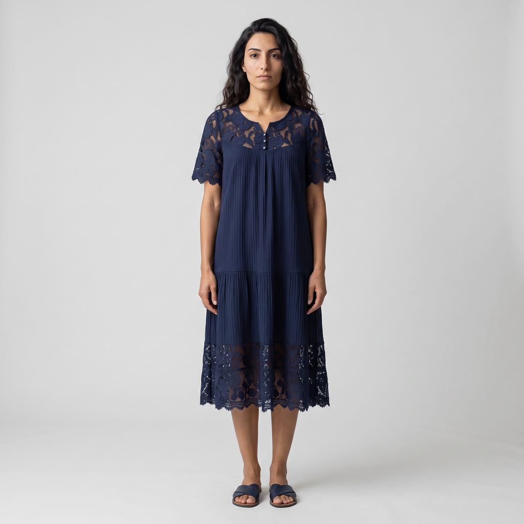 Model wearing the navy lace trim tiered midi dress, full length studio shot