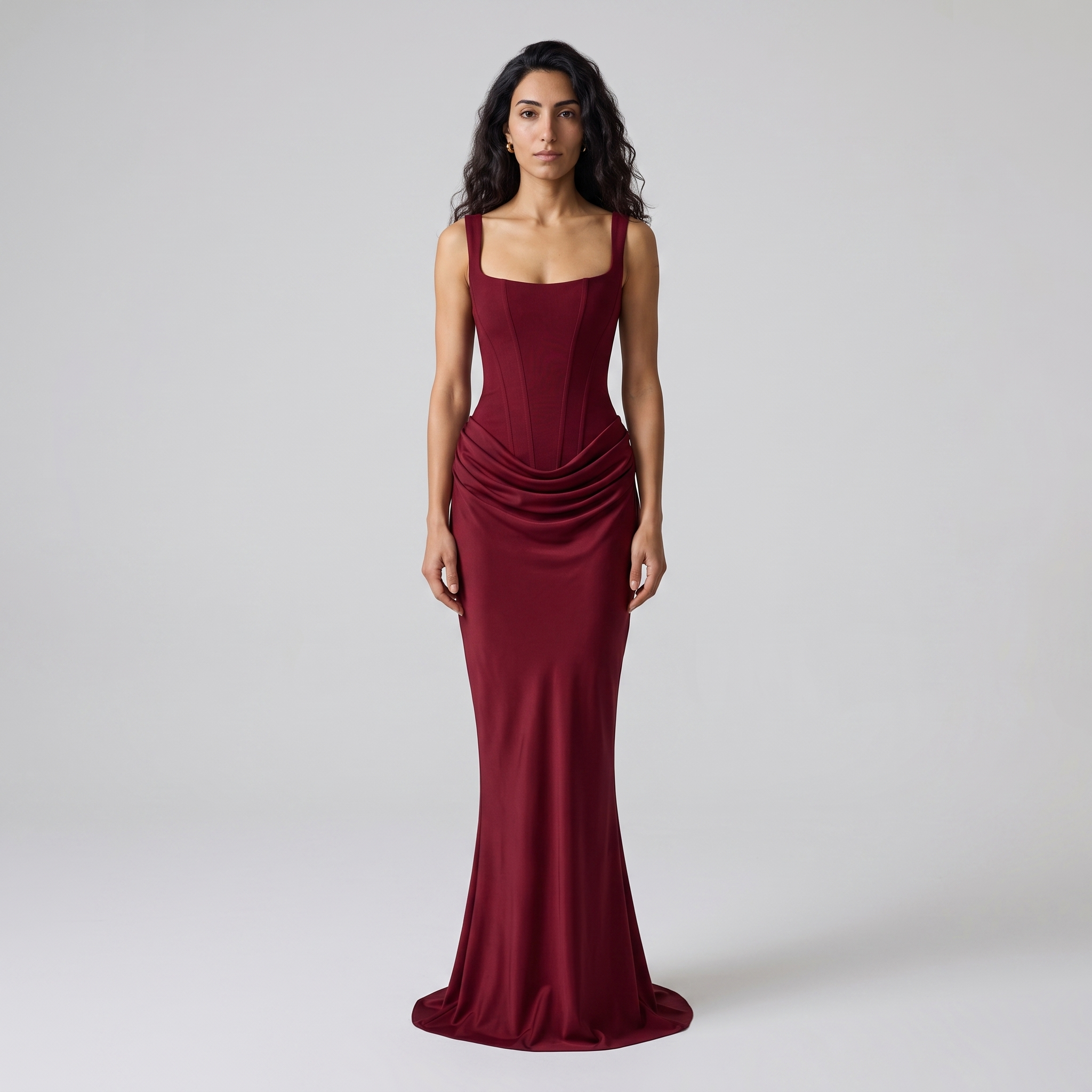 Model wearing the wine red square neck corset maxi dress, studio shot